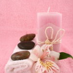 Pink candle with towel